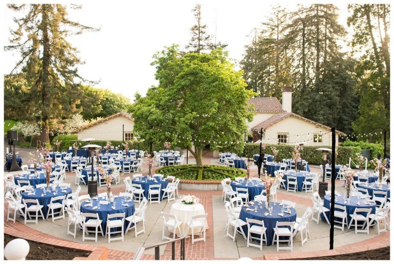 This image shows many tables set up for a wedding.