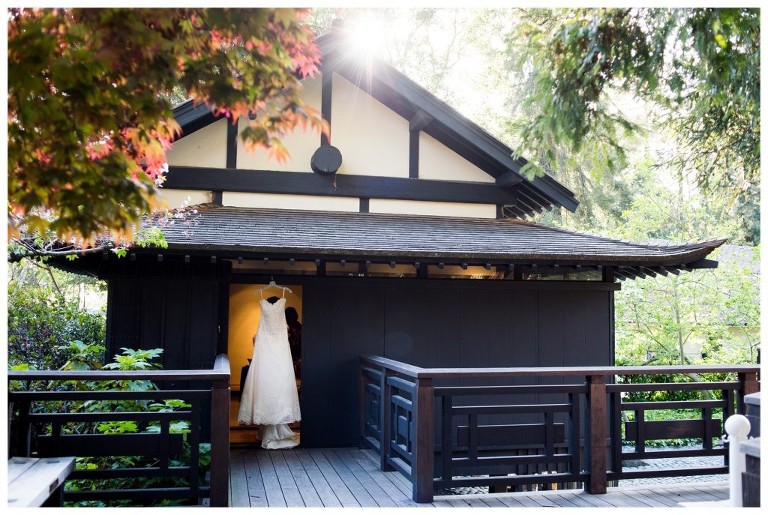 A wedding dress hangs in the Japanese Tea house at the Piedmont Community Hall.