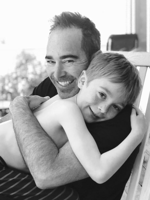 Greg Gill of Gill Gardens hugging his son